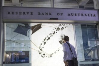 Australia's central bank signals more tightening ahead after hiking rates to decade high