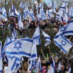 Thousands protest Netanyahu's plan to weaken Israel's judiciary as president warns of 'social collapse'