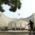 China makes surprise rate cut to boost banking liquidity and the economy