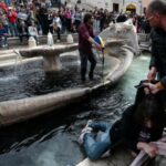 Climate activists dye Spanish Steps fountain water black