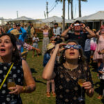 Flocking to One of the Few Specks of Land in Sight of a Total Eclipse