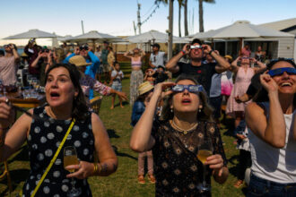 Flocking to One of the Few Specks of Land in Sight of a Total Eclipse