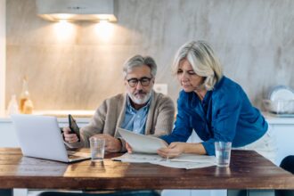 A couple looks at documents together