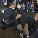 Man arrested after explosion prompts evacuation of Japanese leader from speech venue