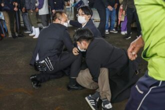 Man arrested after explosion prompts evacuation of Japanese leader from speech venue