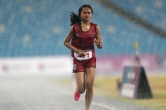 Cambodian Runner Finishes Race Despite Torrential Rain