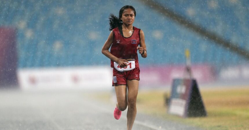 Cambodian Runner Finishes Race Despite Torrential Rain