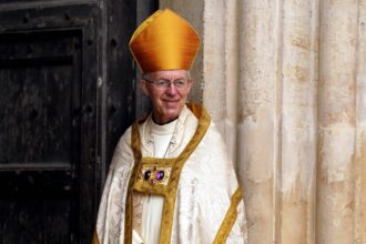 Days After Crowning the King, Archbishop Condemns U.K. Migrant Plan