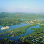 Panama Canal, liner sailing towards Miraflores locks, high view