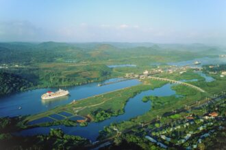 Panama Canal, liner sailing towards Miraflores locks, high view