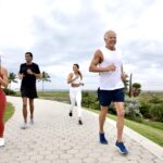 Mark Sisson and friends jogging outside wearing Peluva