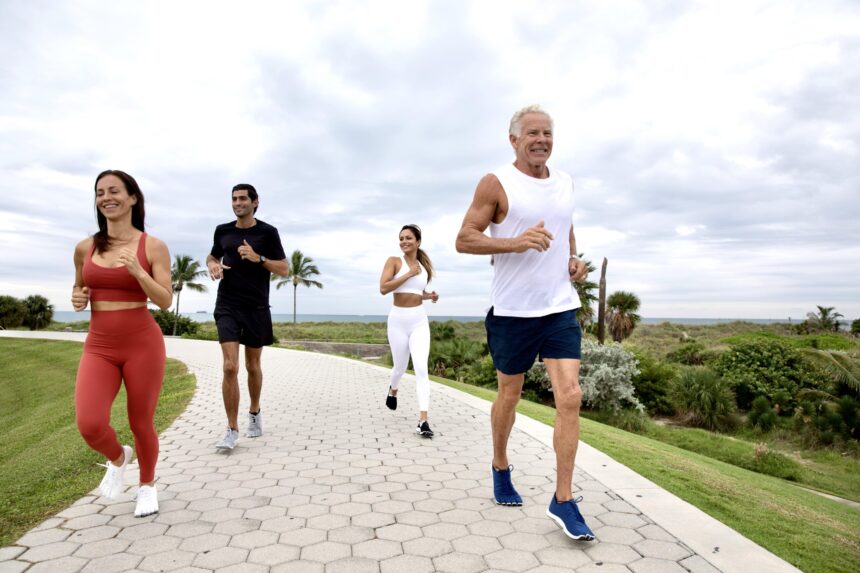 Mark Sisson and friends jogging outside wearing Peluva