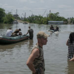 After Dam Destruction in Ukraine, Thousands Flee for Water and Shelter