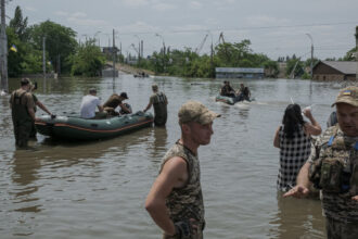 After Dam Destruction in Ukraine, Thousands Flee for Water and Shelter