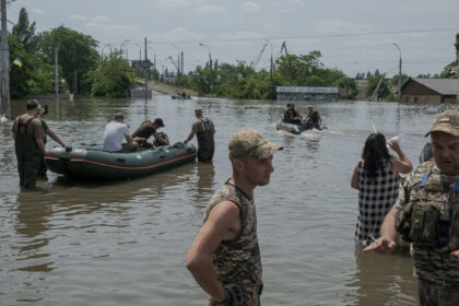 After Dam Destruction in Ukraine, Thousands Flee for Water and Shelter