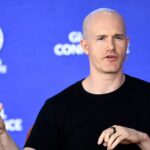 SEC sues Coinbase over exchange and staking programs, stock drops 22%