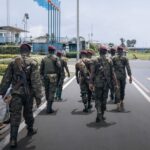 Soldiers of the Congolese Republican Guard walk on the tarmac of the airport in Goma, eastern Democratic Republic of Congo, on 12 November 2022.