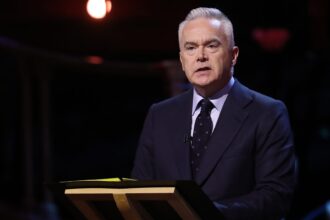 Huw Edwards named as BBC anchor accused of paying teen for explicit pictures