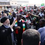 Iranian President Ebrahim Raisi (L) is welcomed with an official ceremony by President of Zimbabwe Emmerson Mnangagwa (R) in Harare, Zimbabwe on 13 July 2023.