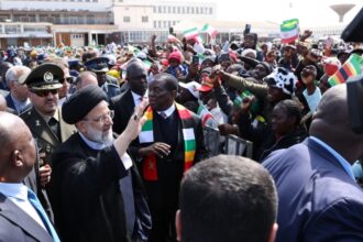 Iranian President Ebrahim Raisi (L) is welcomed with an official ceremony by President of Zimbabwe Emmerson Mnangagwa (R) in Harare, Zimbabwe on 13 July 2023.