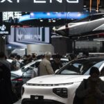 EV makers promote advanced tech to compete in China