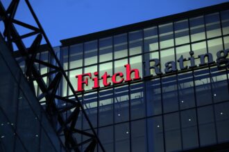 Fitch warns it may be forced to downgrade dozens of banks