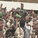 Gabonese soldiers carrying General Brice Oligui Nguema, head of the presidential guard of ousted President Ali Bongo Ondimba, on 30 August 2023.