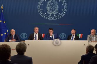 Italian bank shares slide after government surprises with windfall tax