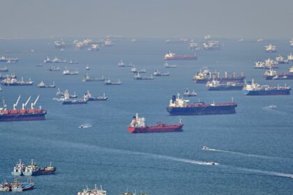 Ships wait at Asian ports as retailers struggle to shift excess stock