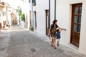 Mother and son playing on the street