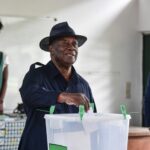 Ivorian president Alassane Ouattara casts his ballot during the municipal and regional elections, in Abidjan, on 2 September 2023.