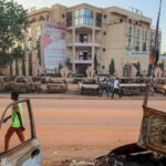 Burnt cars in front of the headquarters of the Parti nigérien pour la démocratie et le socialisme (Niger Party for Democracy and Socialism) of the deposed president of Niger, Mohamed Bazoum, in Niamey on 19 September 2023.