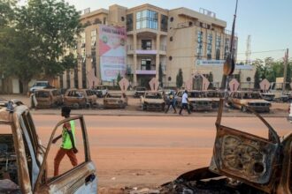 Burnt cars in front of the headquarters of the Parti nigérien pour la démocratie et le socialisme (Niger Party for Democracy and Socialism) of the deposed president of Niger, Mohamed Bazoum, in Niamey on 19 September 2023.