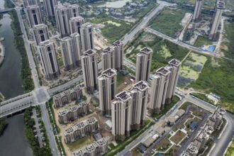 Shares of Evergrande suspended amid reports its chairman under surveillance
