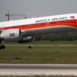 A TAAG Angola Airlines Boeing 777-300ER plane takes off from Lisbon airport in Portugal.