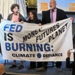 Climate protesters disrupt start of Fed Chair Powell's economic speech