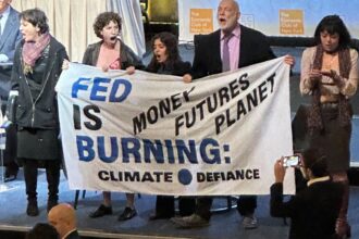 Climate protesters disrupt start of Fed Chair Powell's economic speech