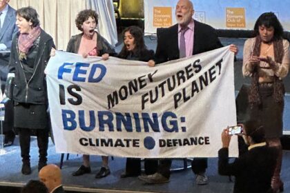 Climate protesters disrupt start of Fed Chair Powell's economic speech