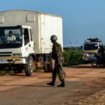 Kenyan police officers check vehicles in the coastal region of Lamu on 2 January 2020.