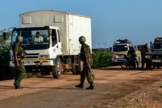 Kenyan police officers check vehicles in the coastal region of Lamu on 2 January 2020.