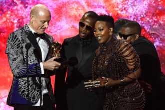 South Africans Wouter Kellerman (flute), Zakes Bantwini (production) and Nomcebo Zikode (vocals) receiving the award for Best World Music Performance at the Grammy Awards in Los Angeles on 5 February 2023.