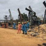 Perenco oil company managers and technicians near the onshore oil wells in operation on the outskirts of Muanda, on the southwestern tip of the DRC on 19 October 2021.