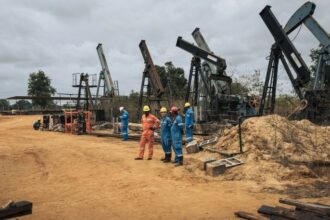 Perenco oil company managers and technicians near the onshore oil wells in operation on the outskirts of Muanda, on the southwestern tip of the DRC on 19 October 2021.