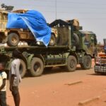 A military truck of the Nigerien security forces, part of an escort to a French Army military convoy crosses the Lazaret district in Niamey on 10 October 2023.