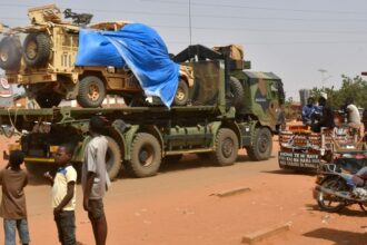 A military truck of the Nigerien security forces, part of an escort to a French Army military convoy crosses the Lazaret district in Niamey on 10 October 2023.