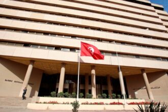 A man walks out of the Central Bank in Tunis, Tunisia, on 27 April 2016.