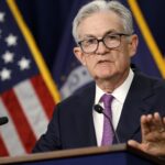 Fed Chair Powell calls talk of cutting rates 'premature' and says more hikes could happen