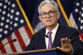 Fed Chair Powell calls talk of cutting rates 'premature' and says more hikes could happen