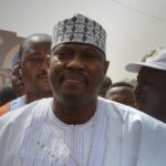 Hama Amadou takes part in a march in Niamey on 15 June 2014.