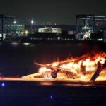 Japan Airlines plane in flames on runway at Tokyo airport